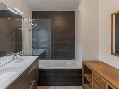 a bathroom with a tub and a sink and a shower at Appartement moderne 3 chambres à Megève avec garage - FR-1-569-131 in Megève