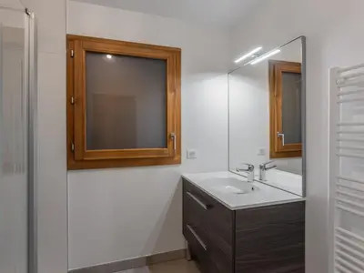 a bathroom with a sink and a mirror at Appartement moderne 3 chambres à Megève avec garage - FR-1-569-131 in Megève
