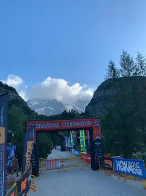a bridge with a mountain in the background at chalet l'ilet ensoleillé /Sunny Island Chalet in Chamonix-Mont-Blanc