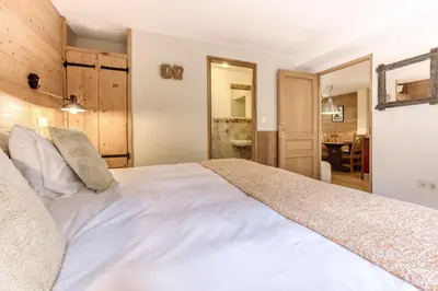 a bedroom with a large white bed in a room at AO HOUSE - PRAKKA Base Camp in Les Houches