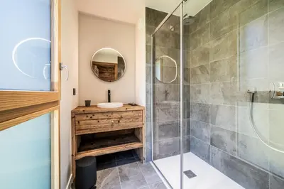 a bathroom with a shower and a sink at Apartment Tourmalet Carrôz d'Arâches - BY EMERALD STAY in Les Carroz d'Araches