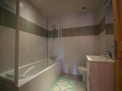 a bathroom with a tub and a toilet and a sink at Appartement 3 pièces - 6 pers - Proche pistes et commerces, navette gratuite - FR-1-572-19 in Arâches-la-Frasse