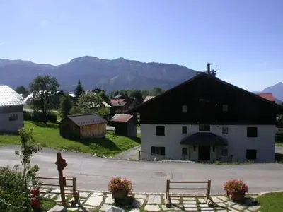 a large white building with a black roof at Appartement 3 pièces - 6 pers - Proche pistes et commerces, navette gratuite - FR-1-572-19 in Arâches-la-Frasse