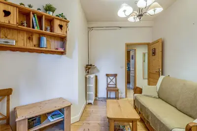 a living room with a couch and a table at Appartement Yodel - Welkeys in Saint-Gervais-les-Bains
