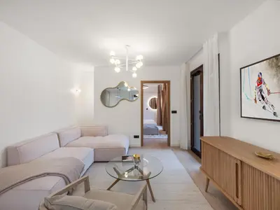 a living room with a couch and a table at Spacieux appartement moderne à Megève, 6 personnes - FR-1-569-129 in Megève