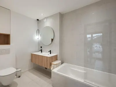 a bathroom with a tub and a sink and a toilet at Spacieux appartement moderne à Megève, 6 personnes - FR-1-569-129 in Megève