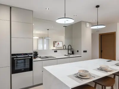 a kitchen with white cabinets and a white counter top at Spacieux appartement moderne à Megève, 6 personnes - FR-1-569-129 in Megève