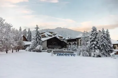 a lodge in the snow with snow covered trees at Flat - Le Whivern A stone's throw from the village centre in Megève