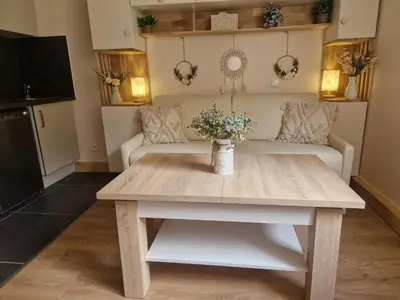 a living room with a table and a couch at Le Mont Bohème in Saint-Gervais-les-Bains