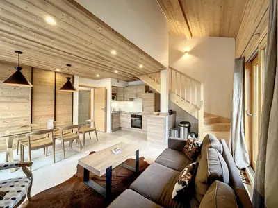 a living room with a couch and a table at Bel appartement 4 pièces près du village, parking inclus - FR-1-560-115 in Combloux