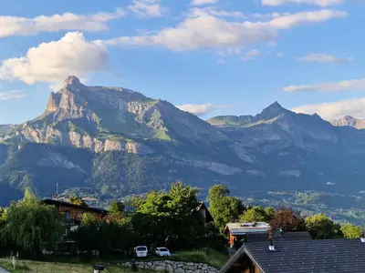 a mountain in the distance with a house in front at Bel appartement 4 pièces près du village, parking inclus - FR-1-560-115 in Combloux
