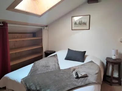 a living room with a wooden table and chairs at Apartment Les Hauts de Saint Gervais-11 by Interhome in Saint-Gervais-les-Bains