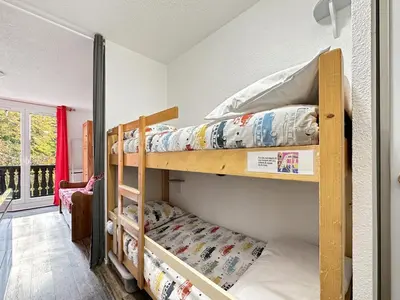 a white bathroom with a washer and dryer at gc462 studio 4 pers proche skibus in Les Carroz d'Araches
