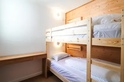 a bunk bed room with two bunk beds at Stunning 4-bedroom apartment Flaine Foret, fully refurbished, beautiful panoramic views in Flaine