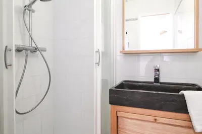 a bathroom with a sink and a shower at Stunning 4-bedroom apartment Flaine Foret, fully refurbished, beautiful panoramic views in Flaine