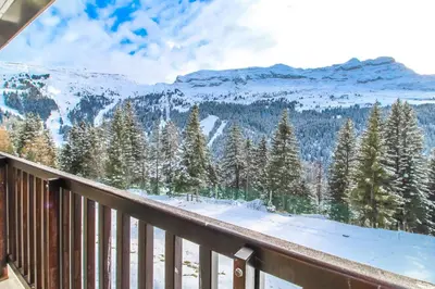 a balcony with a view of a snow covered mountain at Stunning 4-bedroom apartment Flaine Foret, fully refurbished, beautiful panoramic views in Flaine