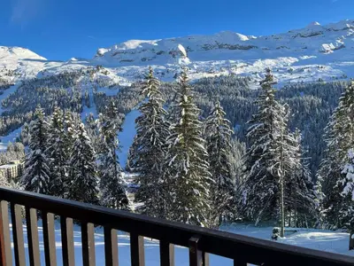 a view of a snow covered mountain from a balcony at Appartement lumineux · Centre station · 6 pers · Balcon · WI-FI - FR-1-425-205 in Arâches-la-Frasse