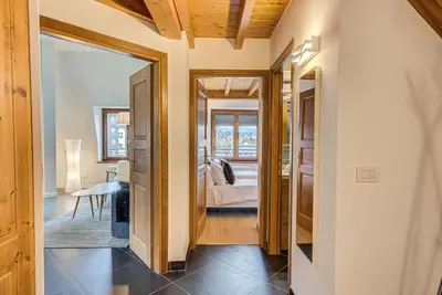 a hallway with a door leading to a bedroom at Apartment Alpes V - Alpes Travel - Central Chamonix - Sleeps 5 in Chamonix-Mont-Blanc