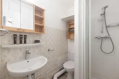 a bathroom with a sink and a toilet and a shower at Studio - Le Vorasson Ideal for a duo break in Saint-Gervais! in Saint-Gervais-les-Bains
