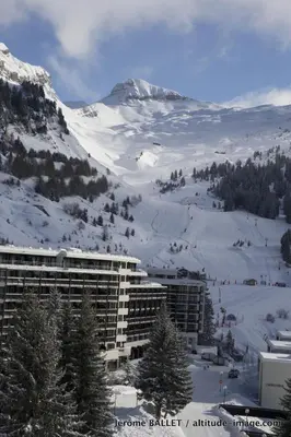 a large building with a ski slope in the snow at NID DOUILLET DE FLAINE in Flaine