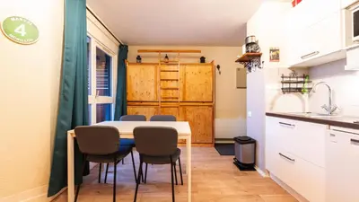 a kitchen and dining room with a table and chairs at Grande Neige 44 - Appt renove 4 pers in Morillon