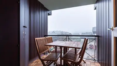 a table and chairs on a balcony with a view at Grande Neige 44 - Appt renove 4 pers in Morillon