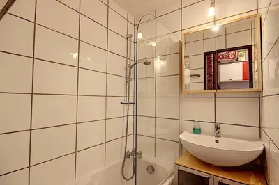 a bathroom with a sink and a shower at Les Hauts De Saint Gervais in Saint-Gervais-les-Bains