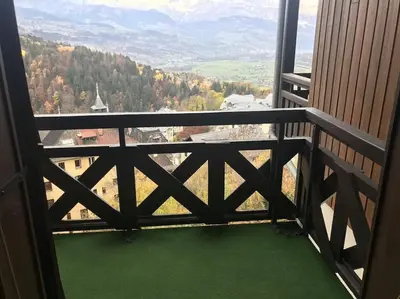 a room with a balcony with a view of a mountain at Les Hauts De Saint Gervais in Saint-Gervais-les-Bains