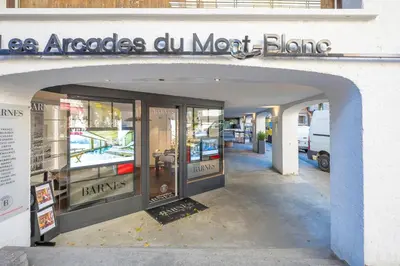 an entrance to a store with a glass door at Résidence Les Arcades du Mont-Blanc in Megève
