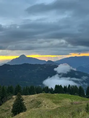 a view of a mountain with clouds in the valley at Arve et Giffre Samoens 1600 in Samoëns