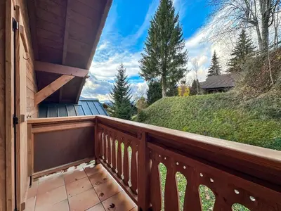 a balcony of a house with a wooden railing at luta11 duplex mezzanine 2 4 pers pied de pistes in Les Carroz d'Araches