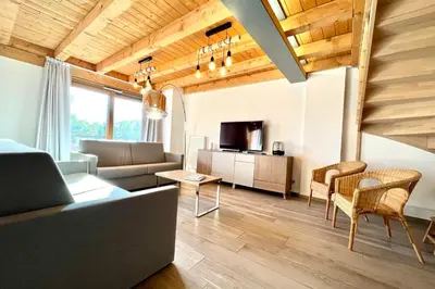 a living room with a couch and a table at Flocon du Medonnet in Combloux