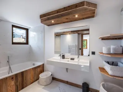 a kitchen and dining room with a long table and chairs at Chalet convivial à proximité des pistes avec balcon et WIFI - FR-1-663-23 in Saint-Gervais-les-Bains