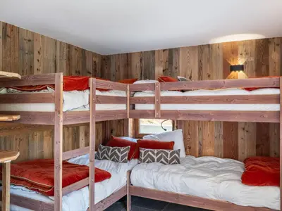 a bedroom with a large bed and a window at Chalet convivial à proximité des pistes avec balcon et WIFI - FR-1-663-23 in Saint-Gervais-les-Bains
