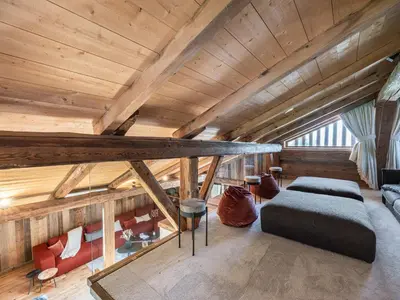 a dining room with a long table and chairs at Chalet convivial à proximité des pistes avec balcon et WIFI - FR-1-663-23 in Saint-Gervais-les-Bains