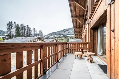 a balcony with a view of the mountains at Apartment Centaurea Megève - BY EMERALD STAY in Megève