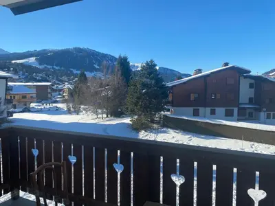 a view from a balcony with snow on the ground at Appartement Au pied du Jaillet in Megève