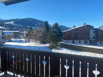 a view from a balcony with snow on the ground at Appartement Au pied du Jaillet in Megève