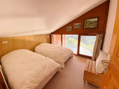 a bedroom with two bunk beds and a window at Appartement 3 pièces 6 pers. à Morillon 1100, proche pistes - FR-1-815-95 in Morillon