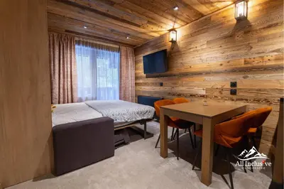 a bedroom with a bed and a table in a room at 