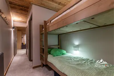 a bedroom with a bunk bed in a room at 
