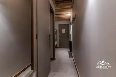 an empty hallway with a hallway leading to a room at 