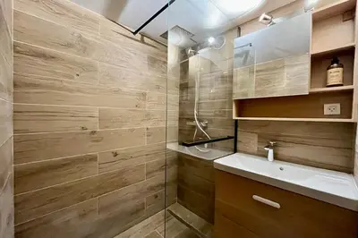 a bathroom with a shower and a sink at Le Doux Sapin in Saint-Gervais-les-Bains