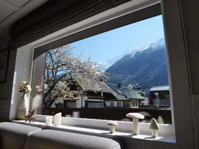 a window with a view of a mountain at Chalet hôtel le Whymper in Chamonix-Mont-Blanc