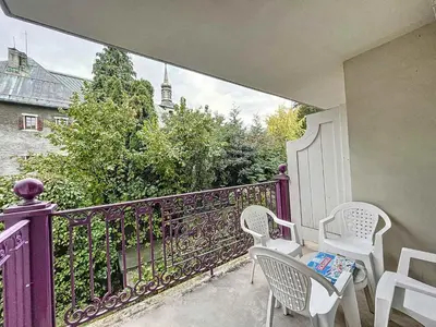 a purple balcony with two chairs and a table at Chamonix: Appartement 3 pièces, 6 pers, Parking - FR-1-507-76 in Chamonix-Mont-Blanc