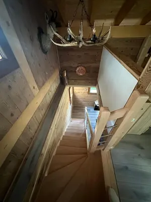 an overhead view of a staircase in a cabin at La Tanière in Samoëns