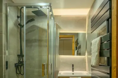 a bathroom with a sink and a shower at Le Cocon Des Pistes in Saint-Gervais-les-Bains
