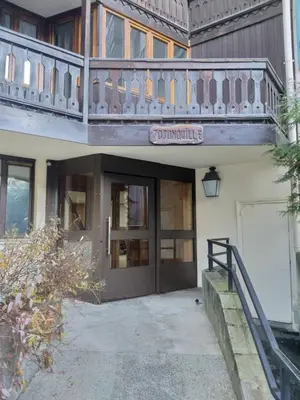 a building with a balcony on top of it at Chez moi in Chamonix-Mont-Blanc