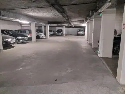 a parking garage with several cars parked in it at Chez moi in Chamonix-Mont-Blanc