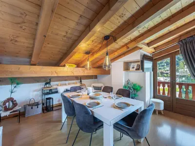 a dining room with a white table and chairs at Appartement 3 ch. à Megève proche centre - FR-1-569-125 in Megève